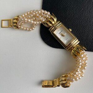 Vintage AWC NY Beautiful vintage gold tone watch with champagne pink pearl